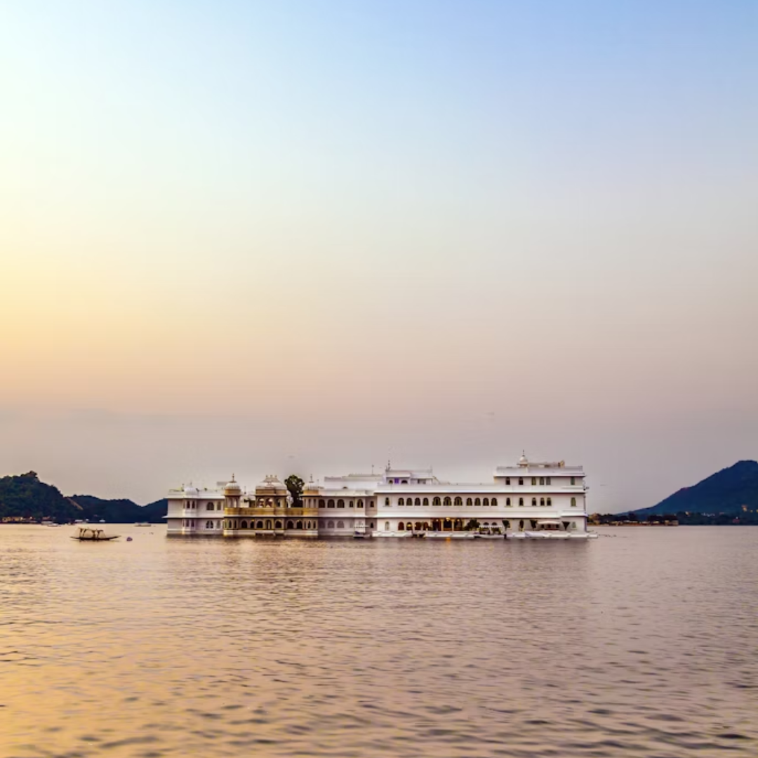 Lake Pichola at golden hour — Udaipur's soul, framed by the City Palace and the Aravalli Hills